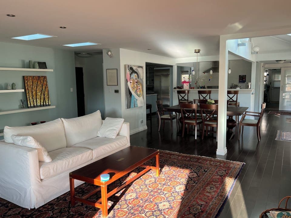 The kitchen flows into the dining area and into the living room.