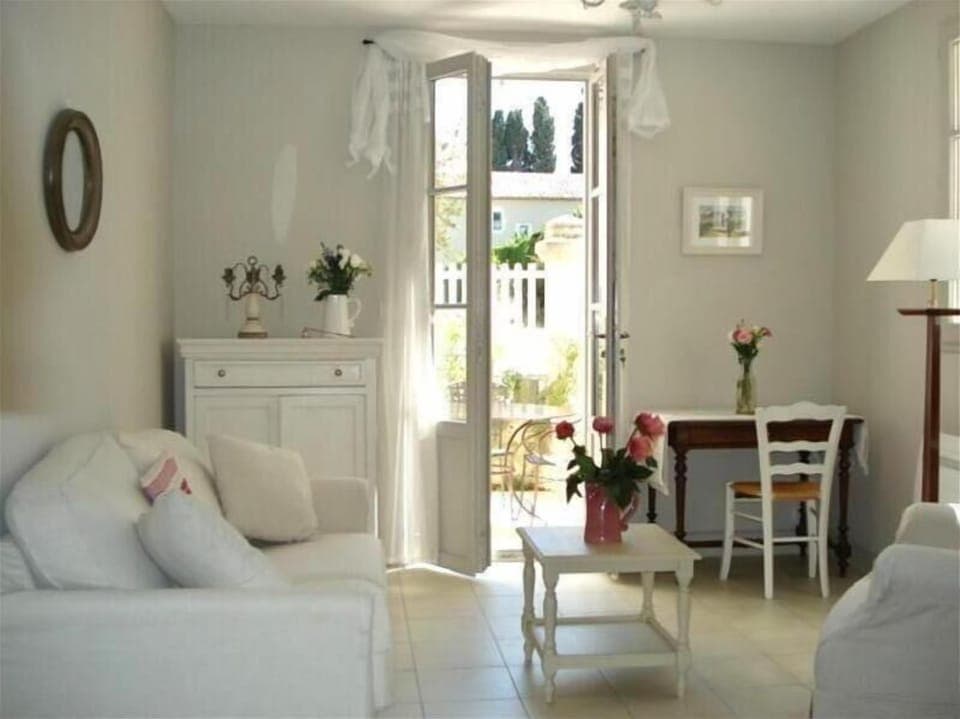 Salon and French doors leadin to private terrace