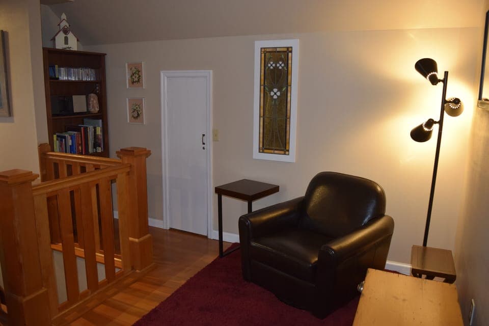 Upstairs sitting area. Twin roll-away bed with memory foam mattress available.