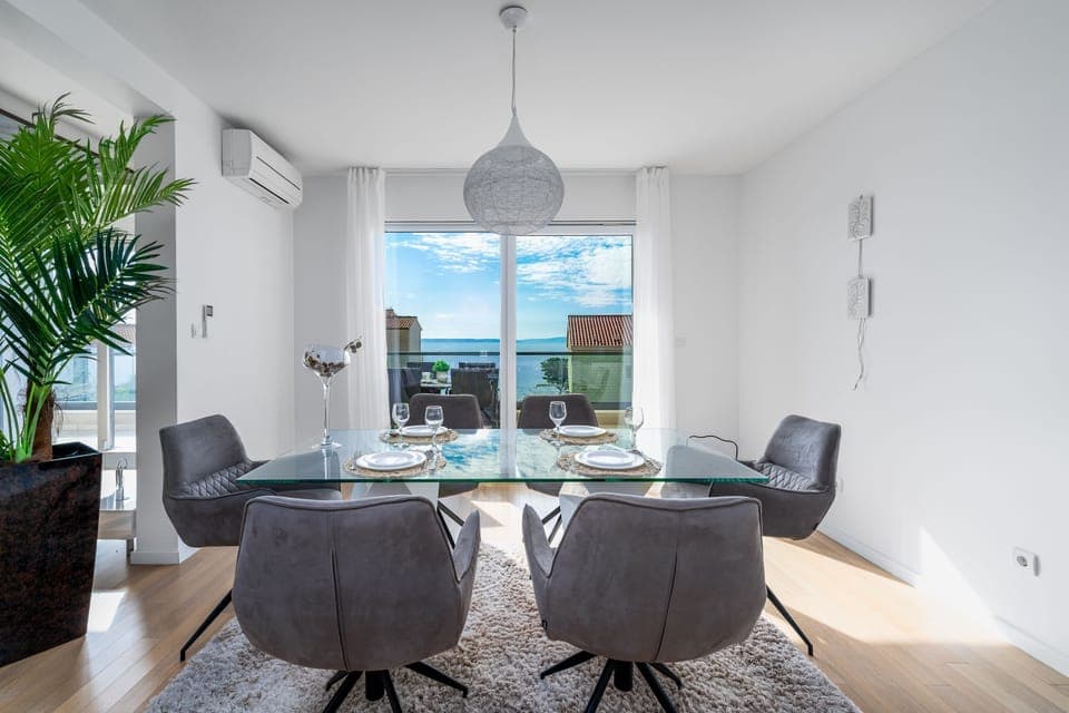 Living and dining area in apartment on the 1st floor with open sea view