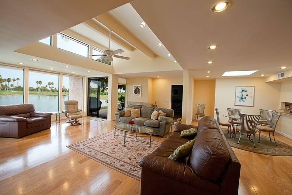 Spacious kitchen with hardwood floors and granite counter tops.