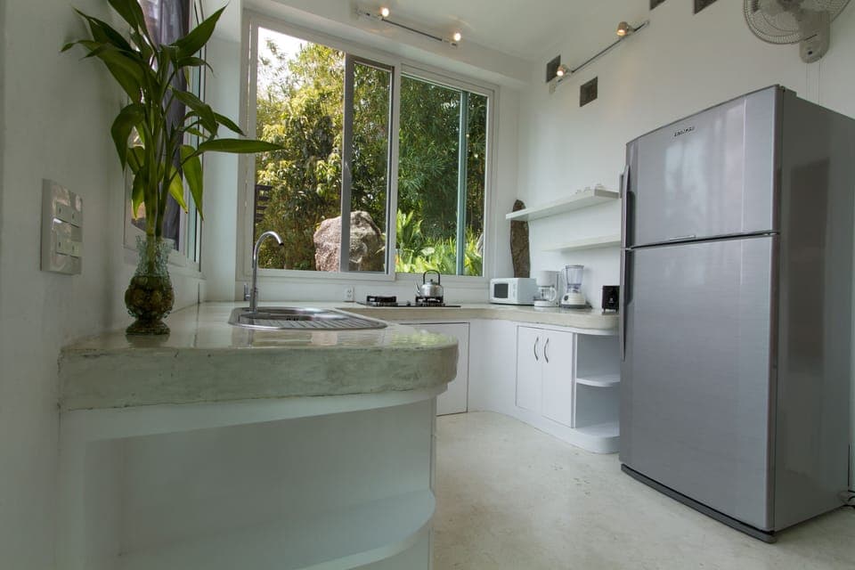 The "Gardenia" villa has a nicely appointed private kitchen, with big fridge!