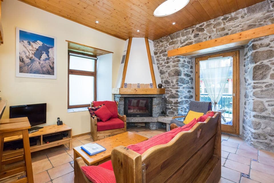 Living room looking towards balcony on the Arve river