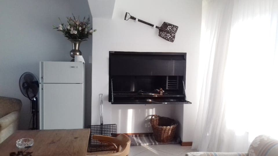 Enclosed barbeque room downstairs.