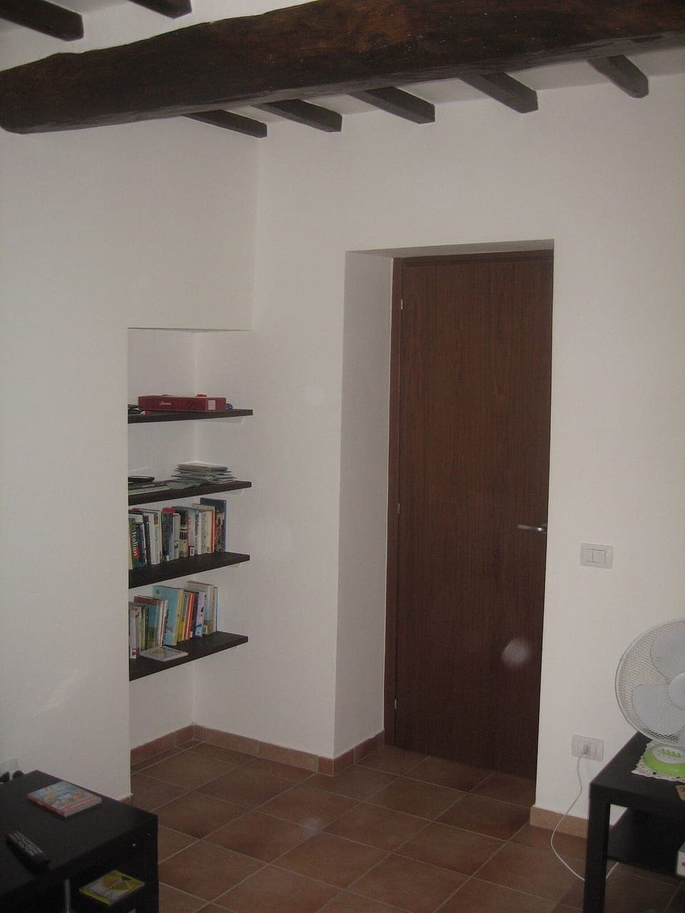 Lounge showing bookshelves / beams