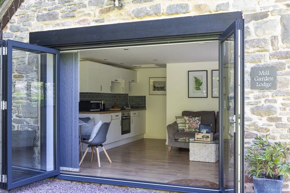 Bi-fold doors opening out onto the Lodge's private garden area