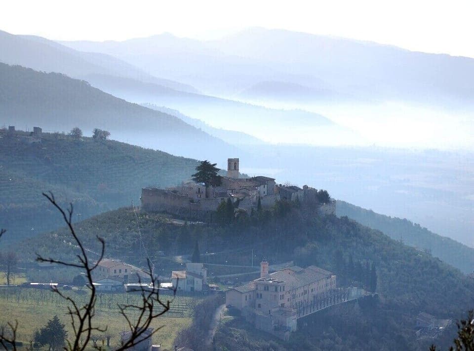 The castle of Campello Alto rises above the Spoleto Valley