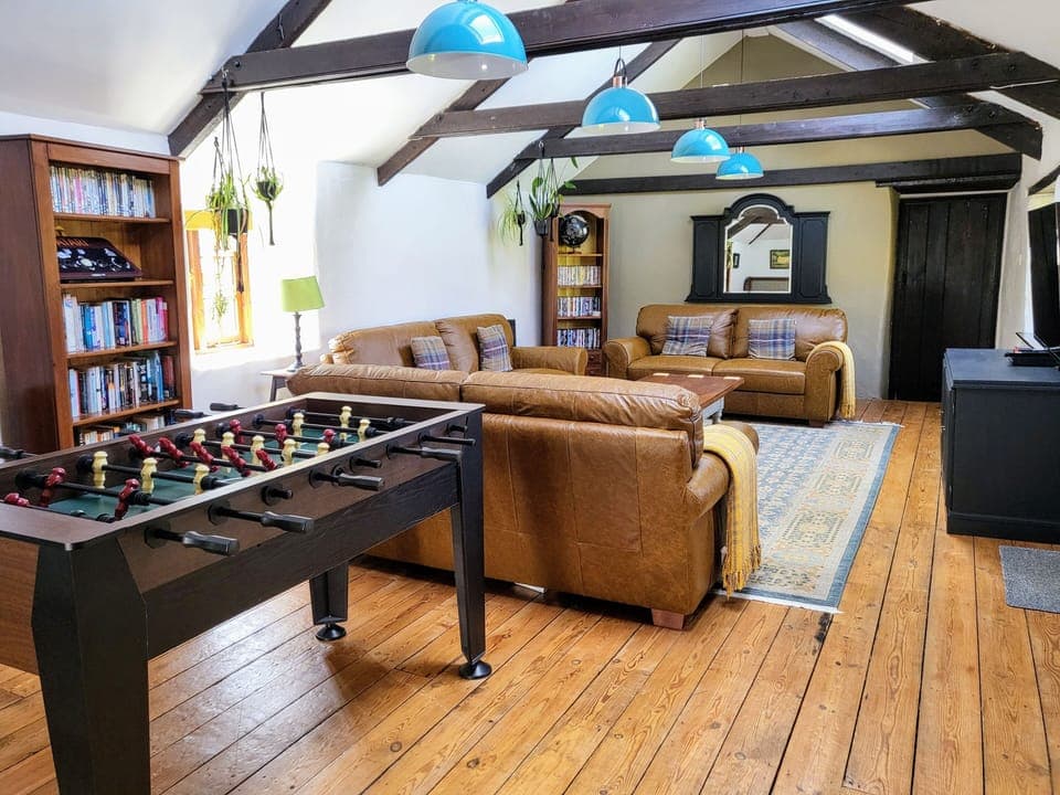 Huge lounge has bag-fulls of character with sanded floors and exposed beams