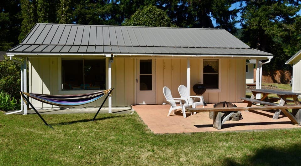 Enjoy views of the river from the patio complete with fire pit and hammock