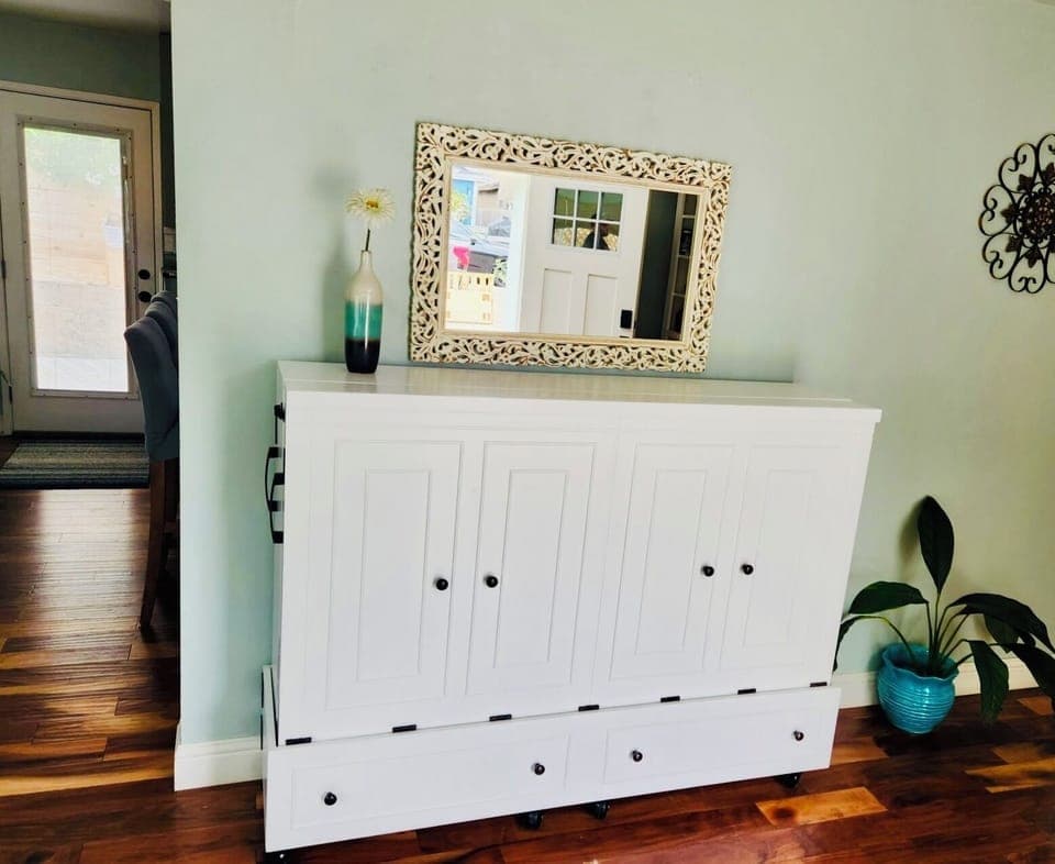 Murphy-style cabinet queen. Roll it out and open like a book. Linens provided.