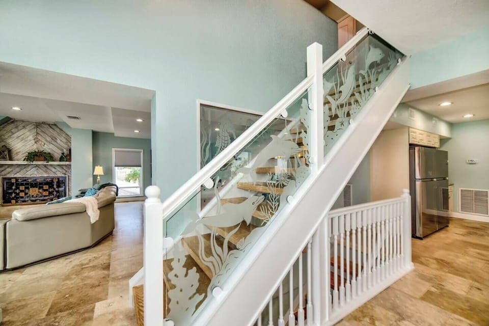 Light up staircase to the top floor - two king rooms on the main floor with bathrooms.