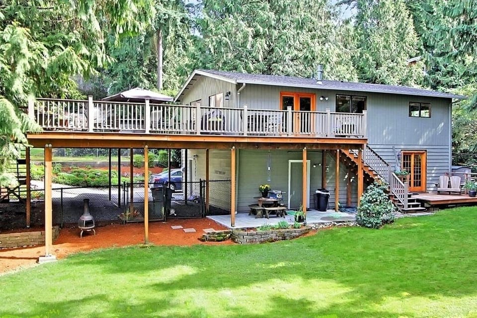 A beautiful home surrounded by a lush green 