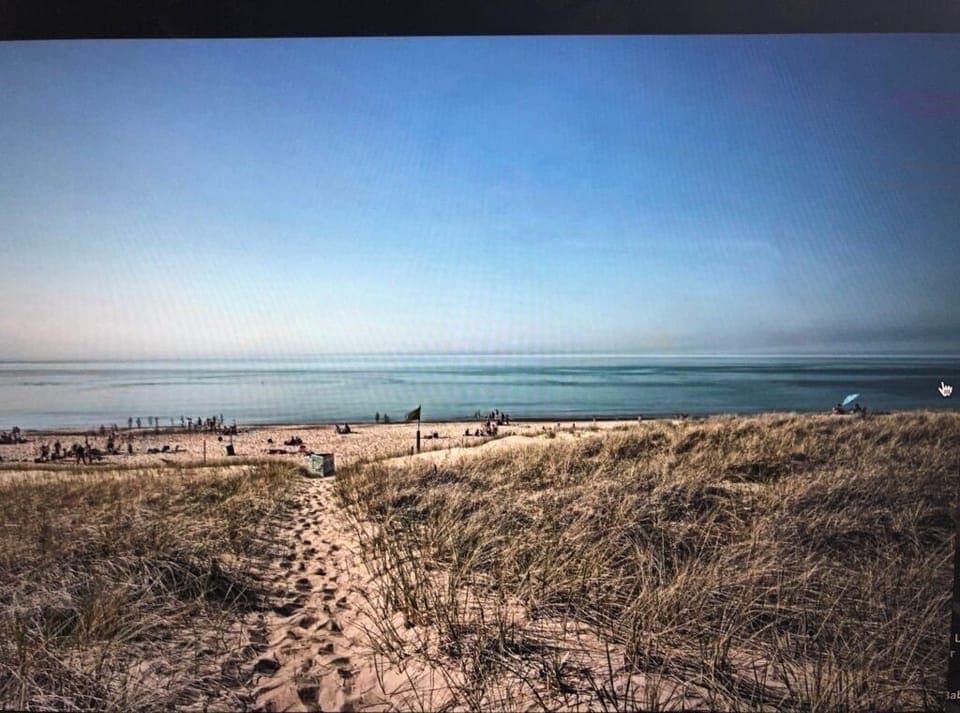 True lakefront property, steps to beach with giant lush grass backyard