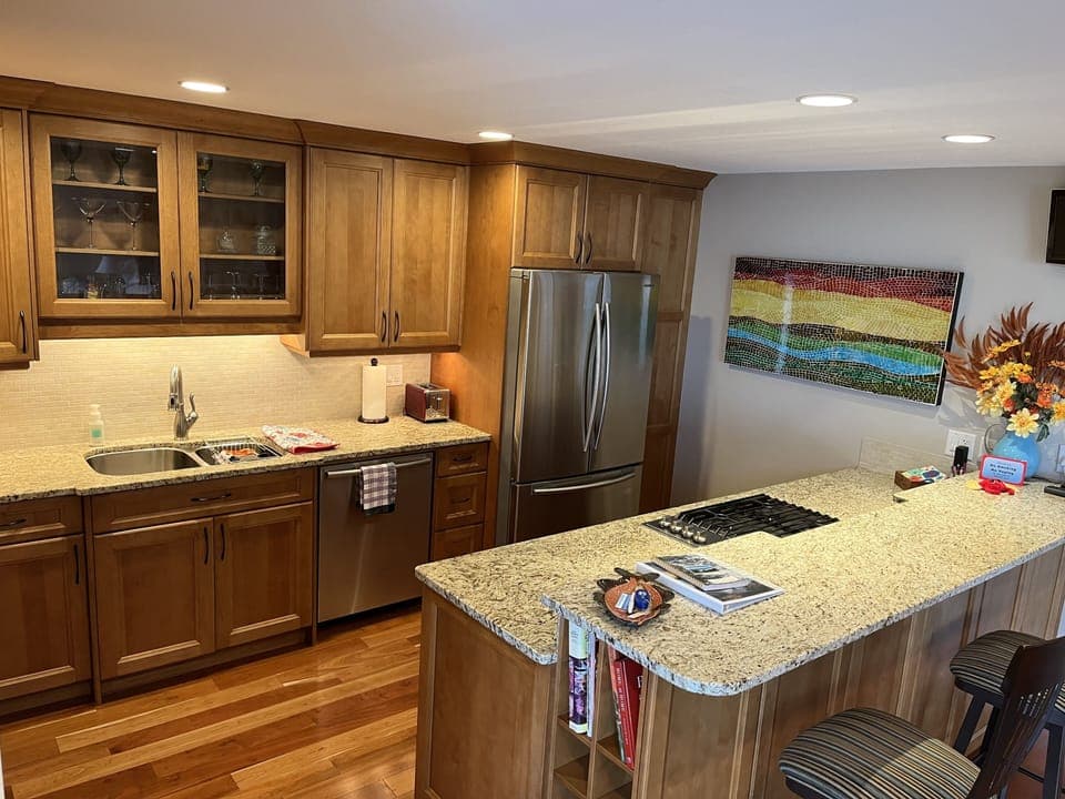 Spacious kitchen with granite countertops and a gas stovetop.