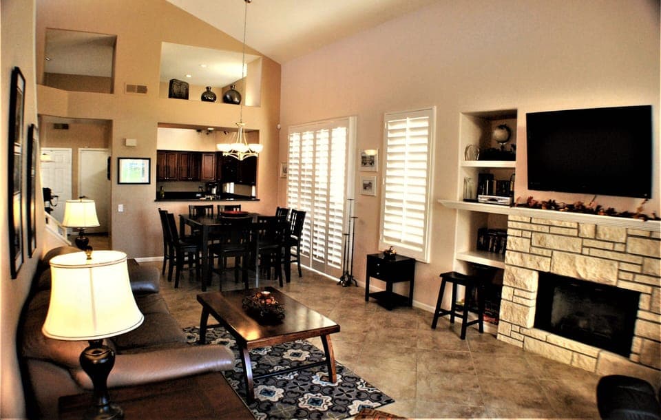 Spacious living room with sofa bed and fireplace