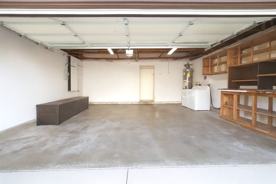 Attached 2-car garage includes washer/dryer and EV charger