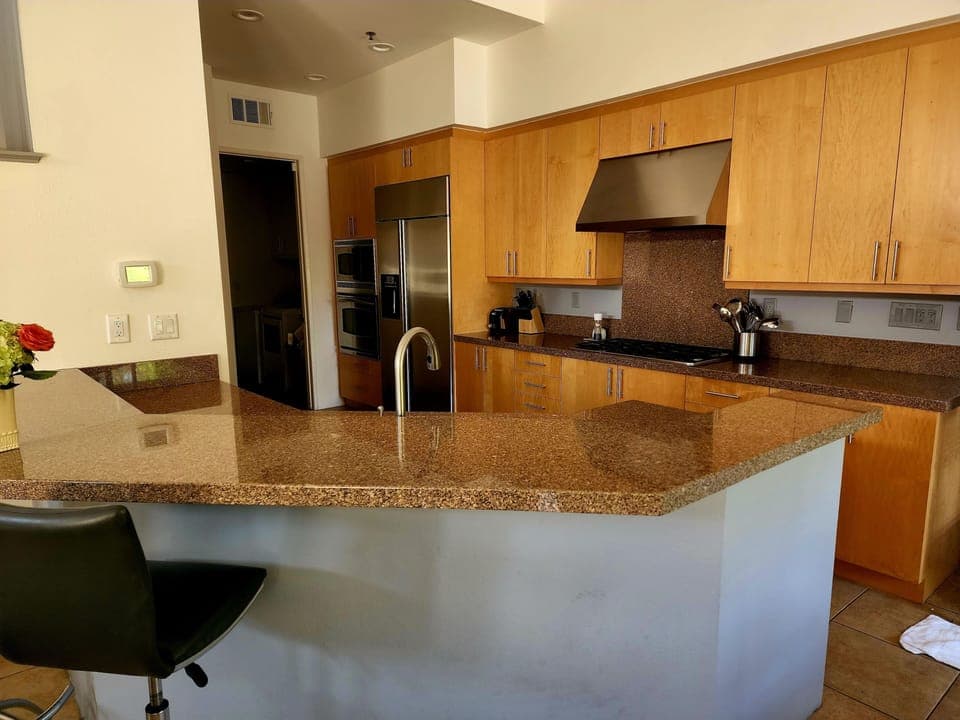 Kitchen includes built in  stove, oven, large refrigerator and microwave