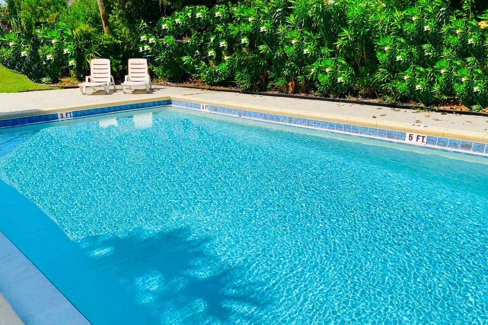Community amenities: Pool, grill, laundry, outdoor shower, & fenced garden!