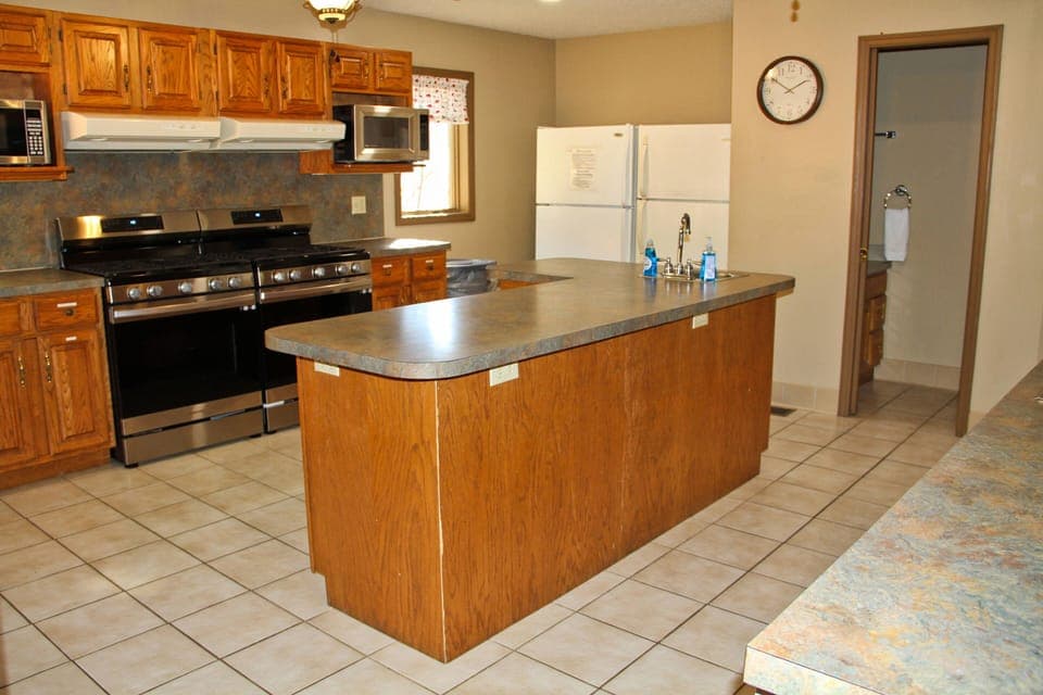 Kitchen complete with dishes and cookware.  Just bring the food and the chef!  