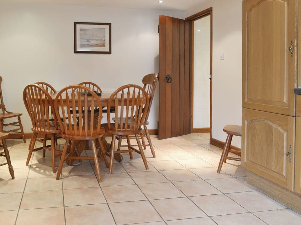 Convenient dining area within kitchen | The Old Workshop - Moor Farm Stable Cottages, Foxley, near Fakenham