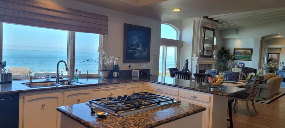 Gourmet Kitchen with Center Island, Stainless Appliances & Ocean View
