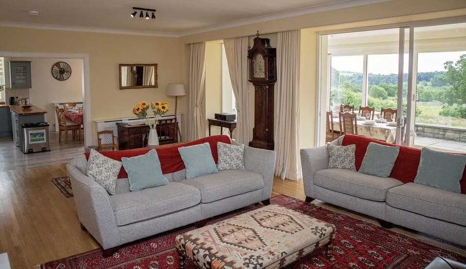 Large living area with access to breakfasting kitchen and dining conservatory