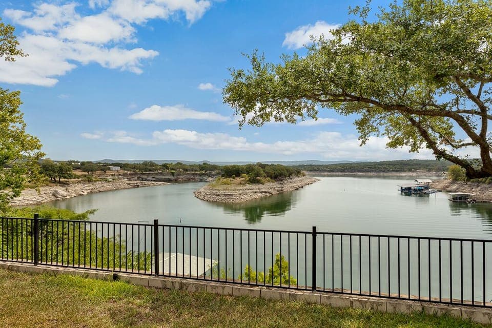 View of lake from fire pit and back yard