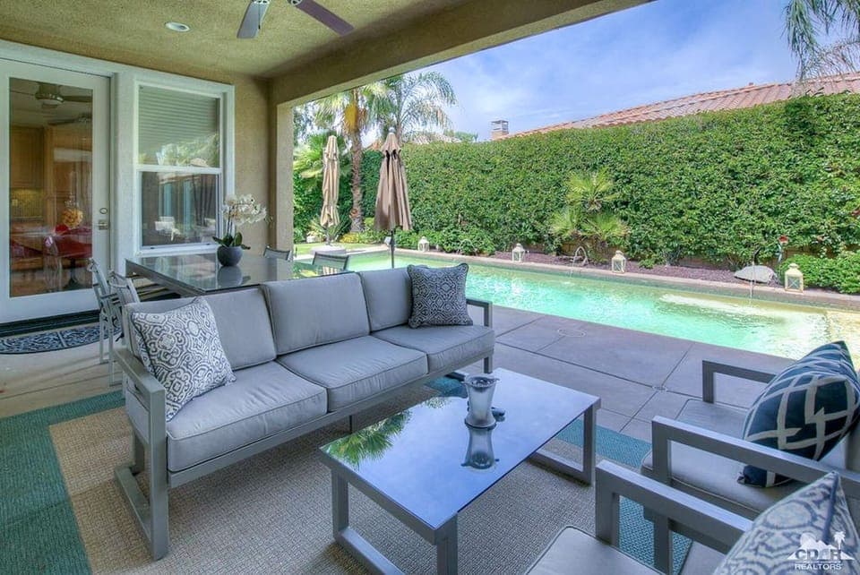 Come outside to Sitting Area with Misting System and Ceiling Fan for comfort.
