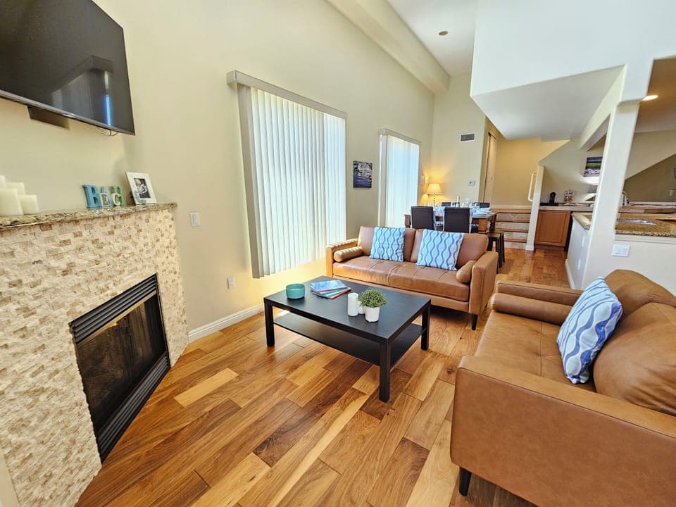 Living room with HDTV and gas fireplace on 2nd floor