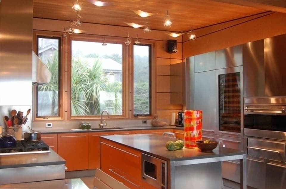 Kitchen with stainless cabinets and caesar stone counters