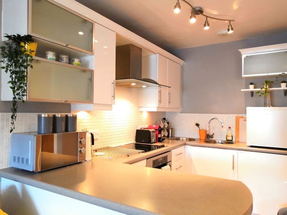Kitchen equipped with hob, oven, microwave, coffee machine, fridge, freezer etc.