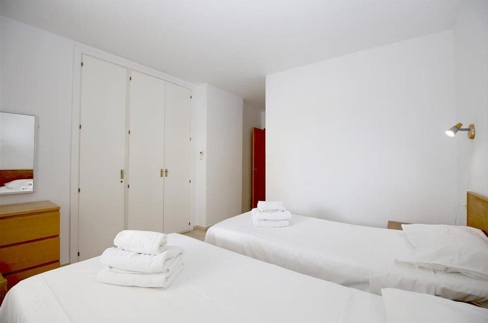 Another picture of the second bedroom with air conditioning and spacious fitted wardrobes