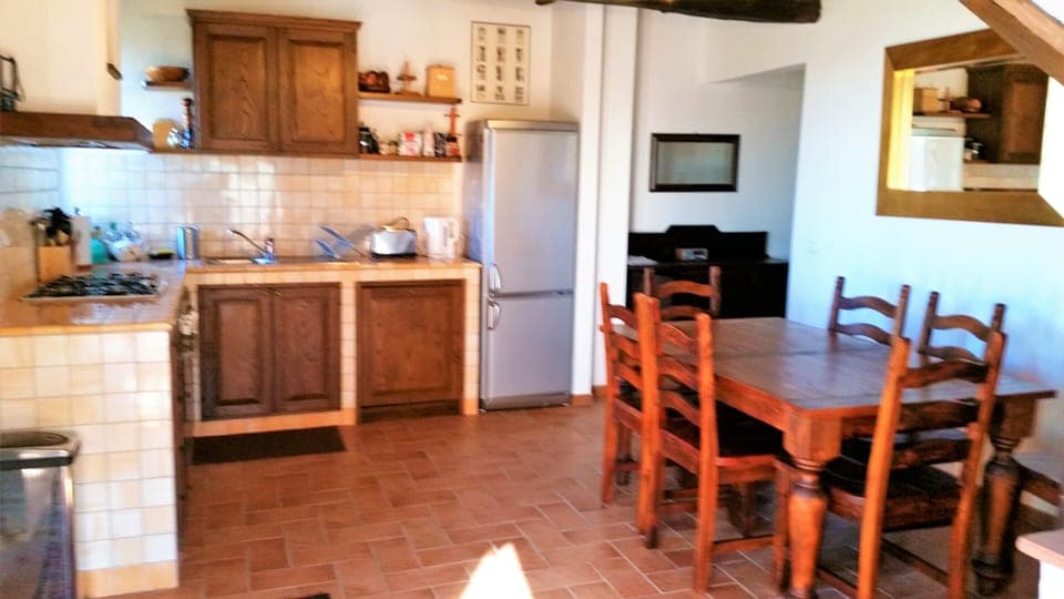 Dining kitchen. Corridor access to downstairs bedrooms to rear.