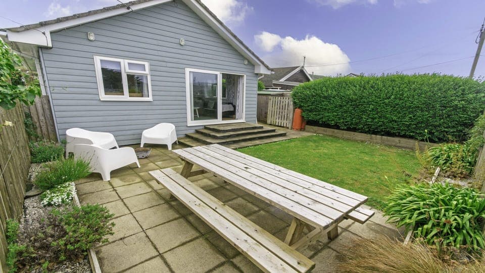 Rear Garden with patio furniture