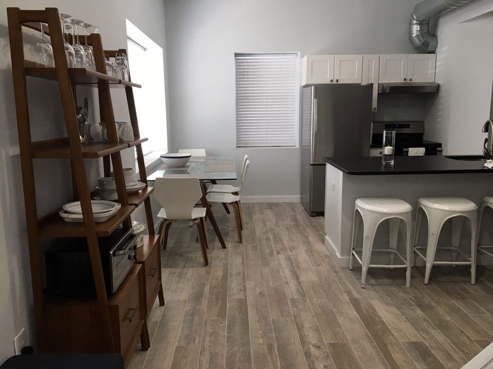 Standing in the doorway, the full kitchen and counter area…and table!   