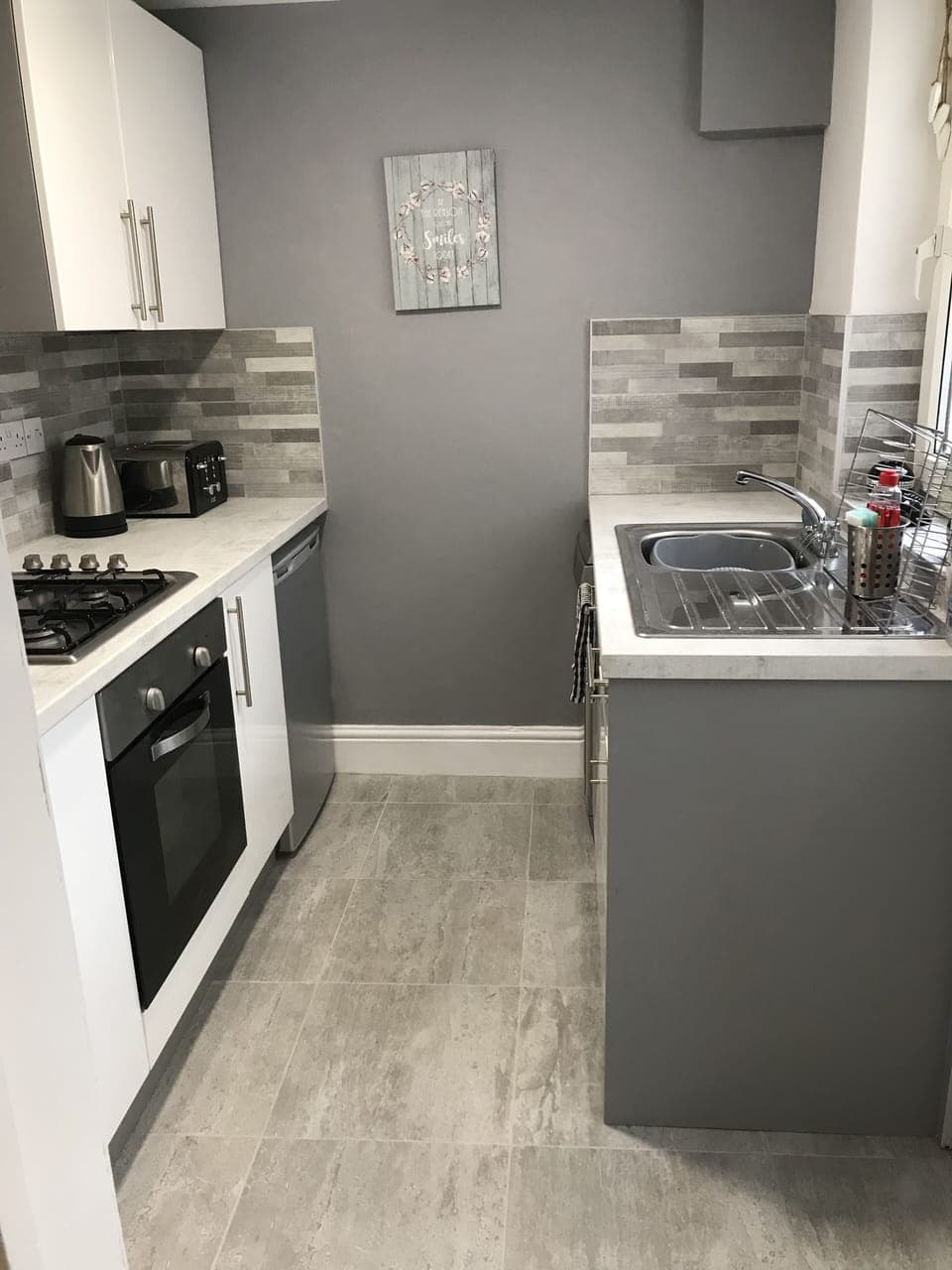 Newly installed kitchen with dishwasher, oven, hob, fridge, microwave etc.