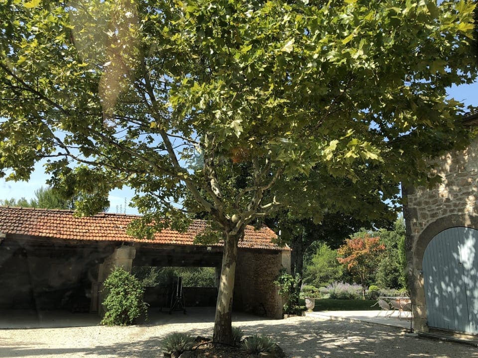 The open garage area next to the house.