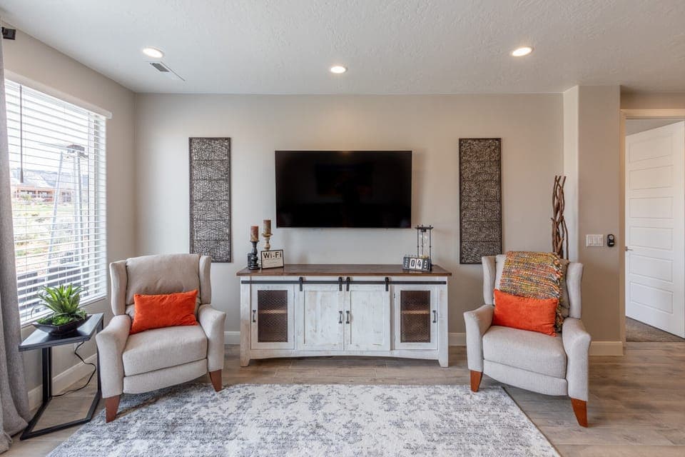 Downstairs Living Room Entertainment Center - The Living Room is located adjacent to the dining room and is the perfect place to relax and watch your favorite movie or TV program.