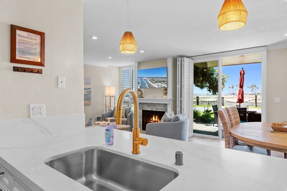 Cook with ease while staying connected to the dining and living areas with views that stretch out to the patio