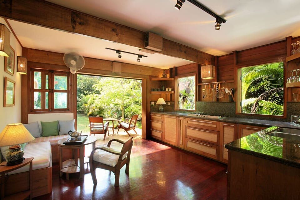 Kitchen with rear deck seating and cliff views.