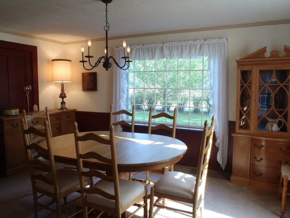 Elegant dining room features service for 8