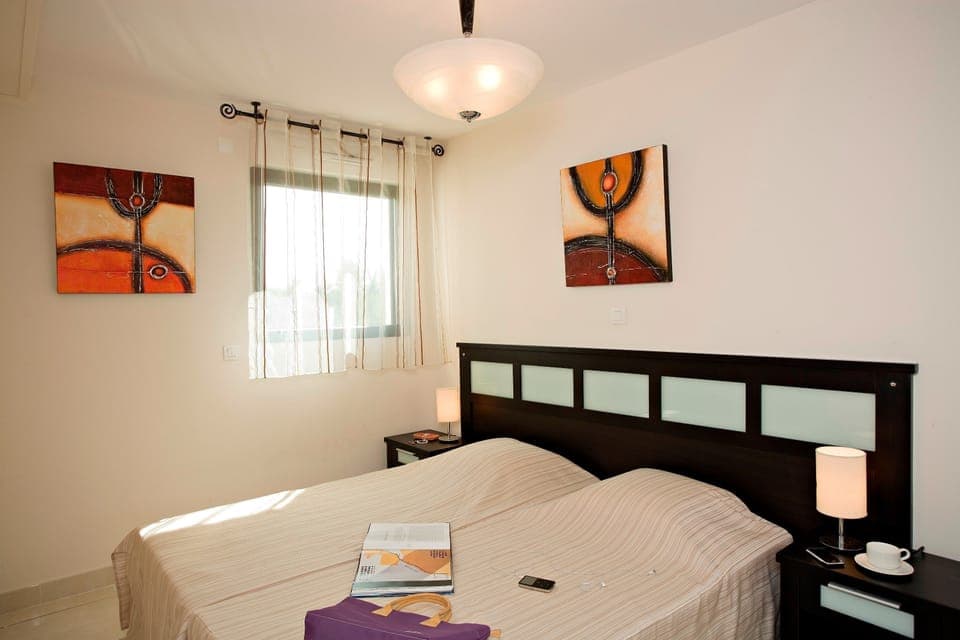 The second bedroom features 2 Single beds.