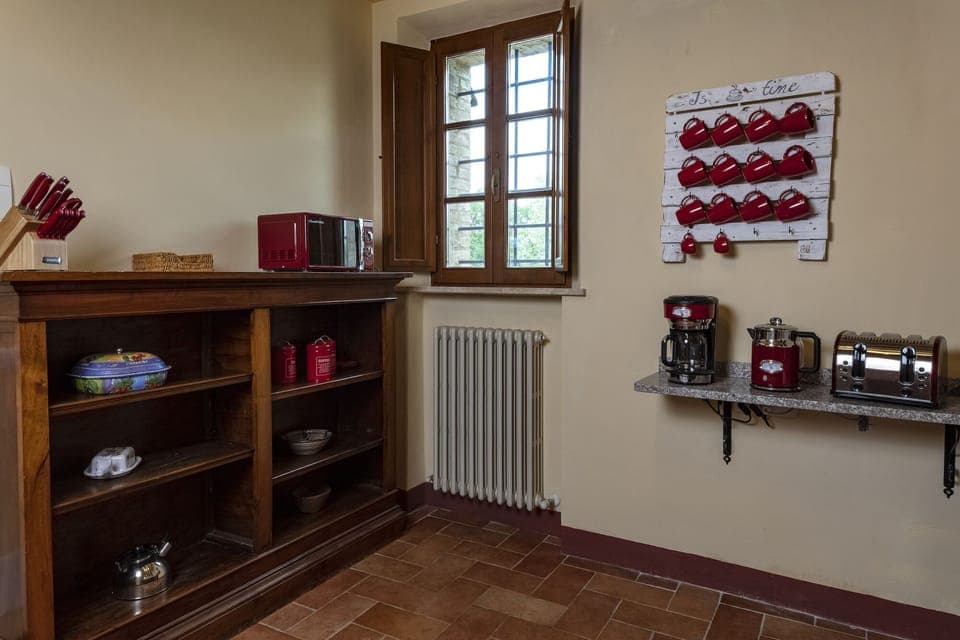 Old bookcase repurposed as kitchen pantry. Breakfast corner on the right