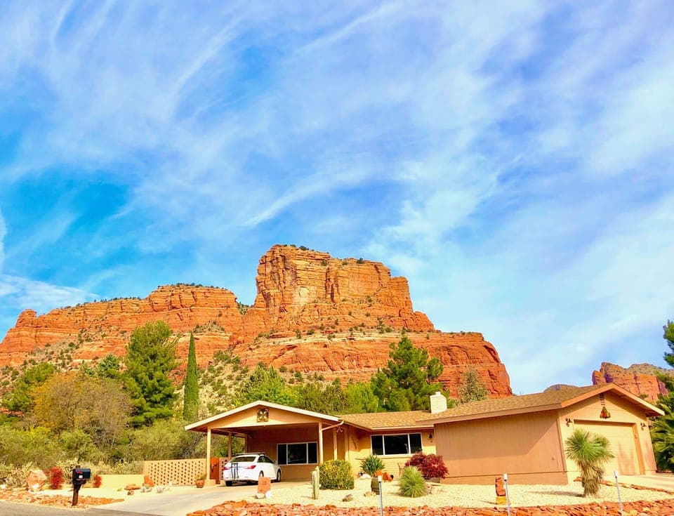 View of our home, front yard, garage & red rocks behind our home