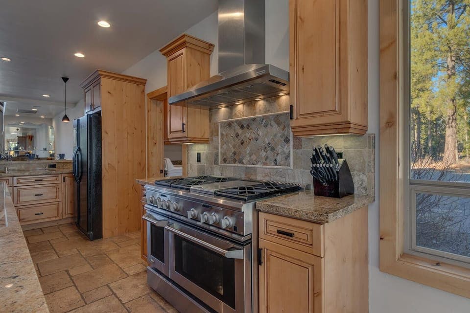- Fully equipped kitchen with premium stainless steel appliances  
- Granite countertops and custom cabinetry for easy meal prep  
- Perfect space to cook and gather with family and friends