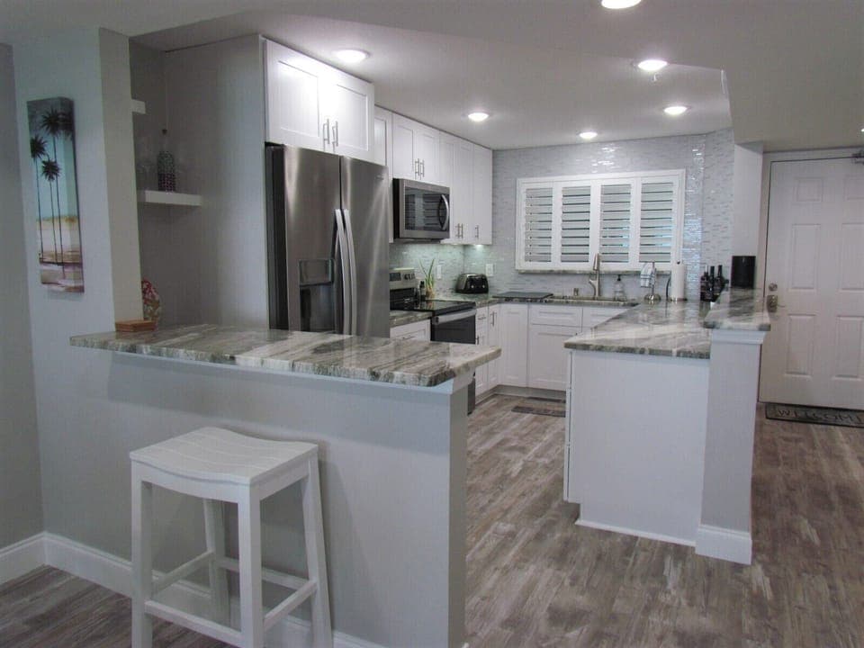 Open Concept Kitchen with Bar Stool Seating - Bar stool seating and an open floor plan to enjoy your family and friends while you're here!