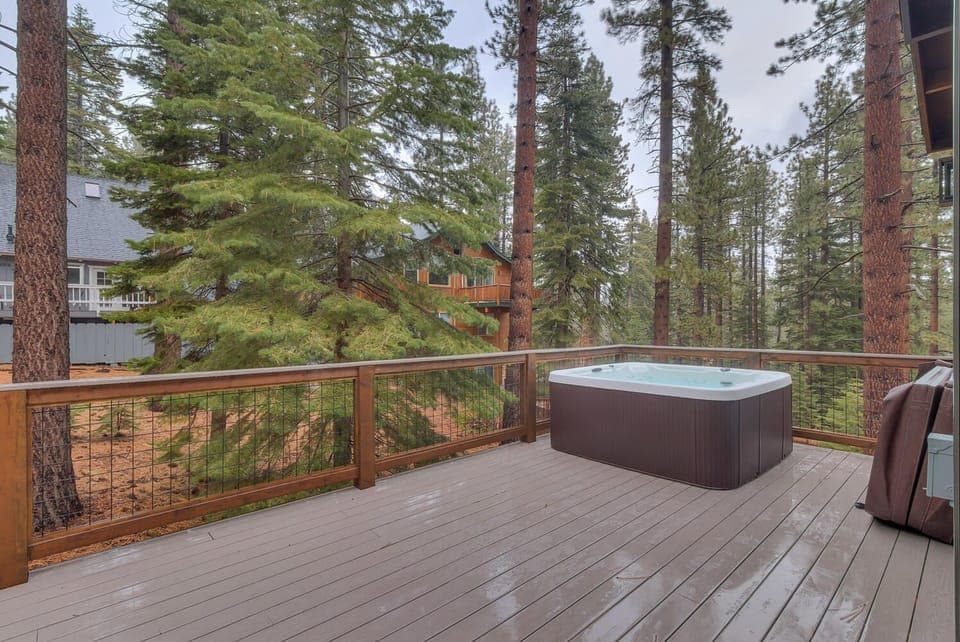 - Private hot tub on forest-view deck  
- Relax among towering pine trees  
- Mountain cabin rental with spa retreat
