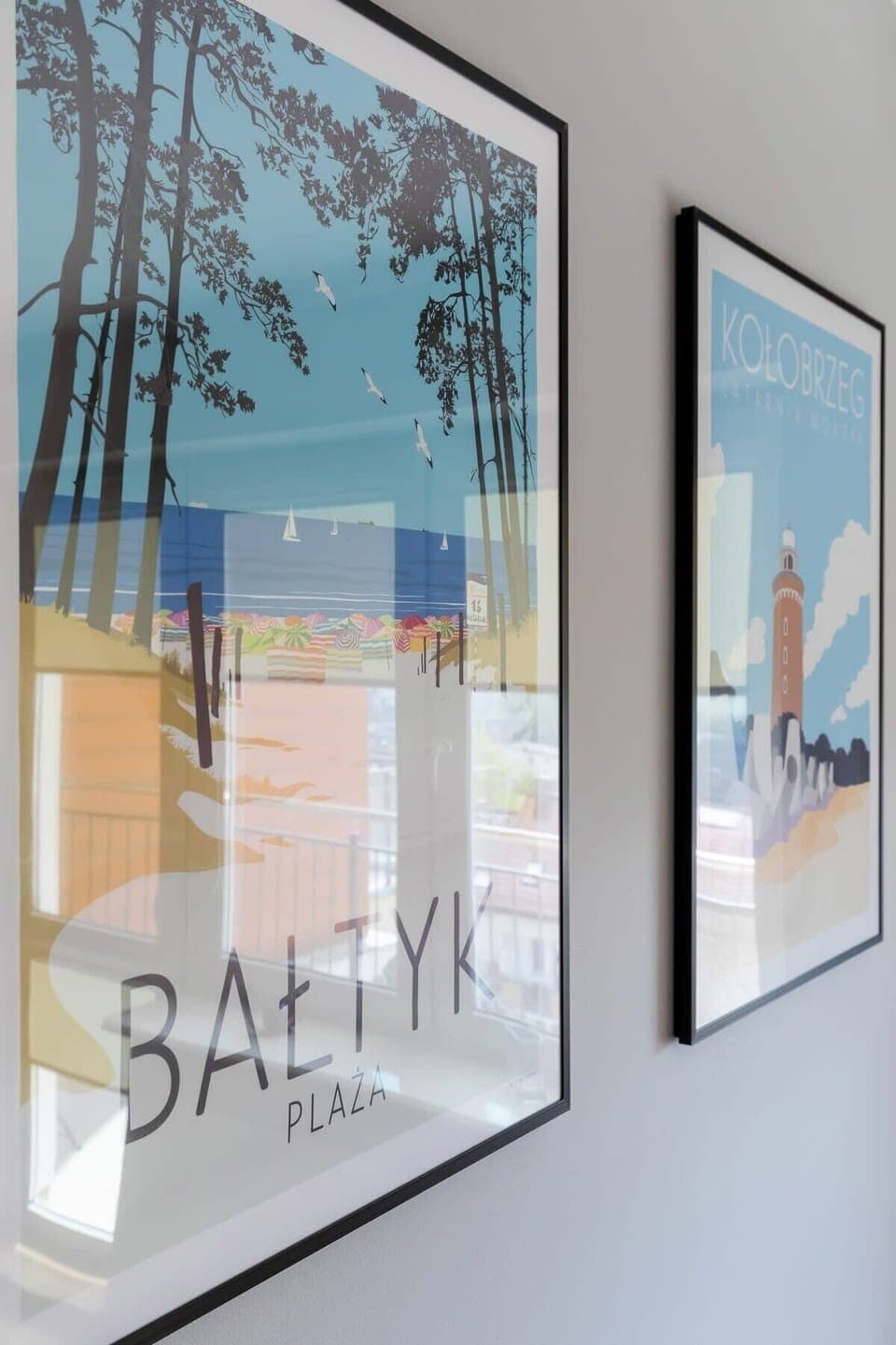 Framed art pieces on the wall, adding personality and color to the room.