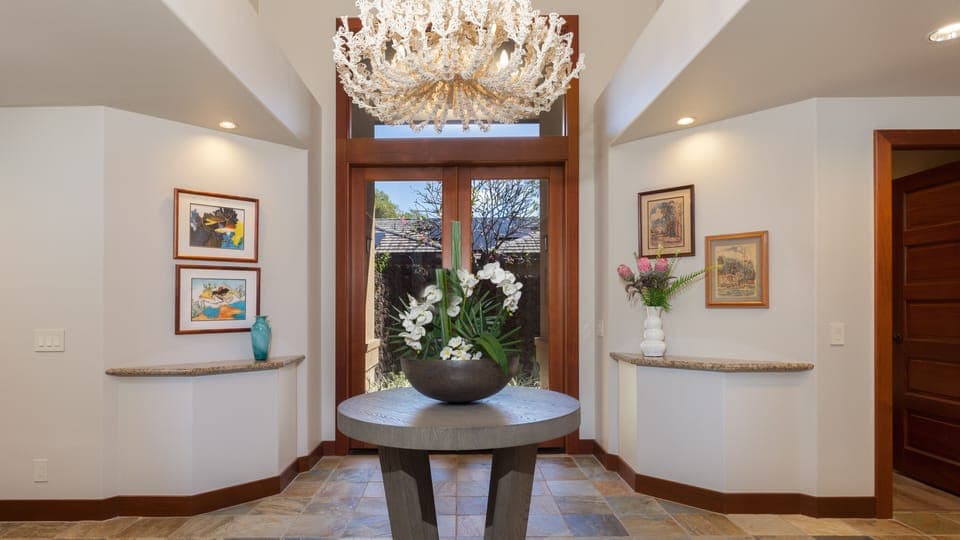 A beautiful coral inspired chandelier welcomes you 