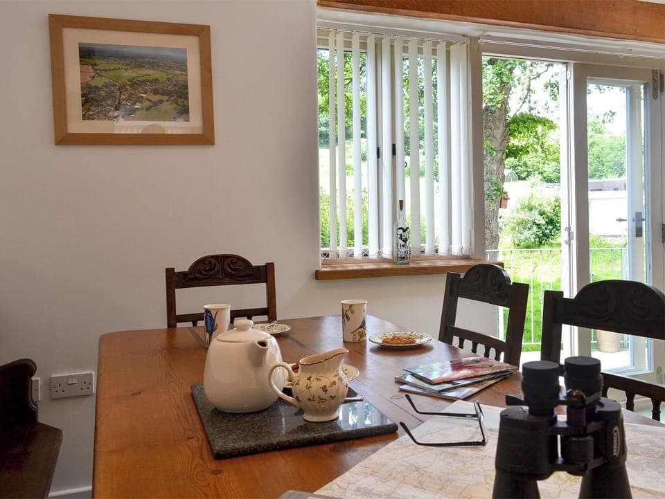 Patio doors leading to courtyard | Fair Maid - Glimsters Farm Holiday let, Kentisbeare, Cullompton